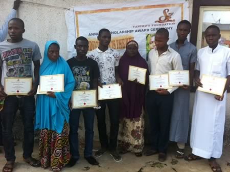 Recipients of 2014 Tanimu Foundation Award displaying their Certificates at the community level.